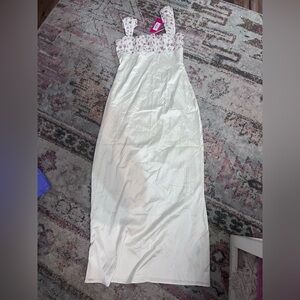 Beginning boutique maxi dress with floral design and cutout